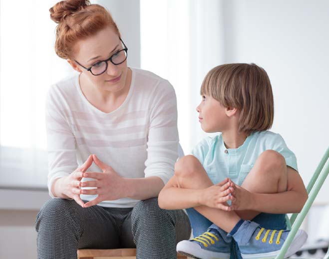 therapist talking with child
